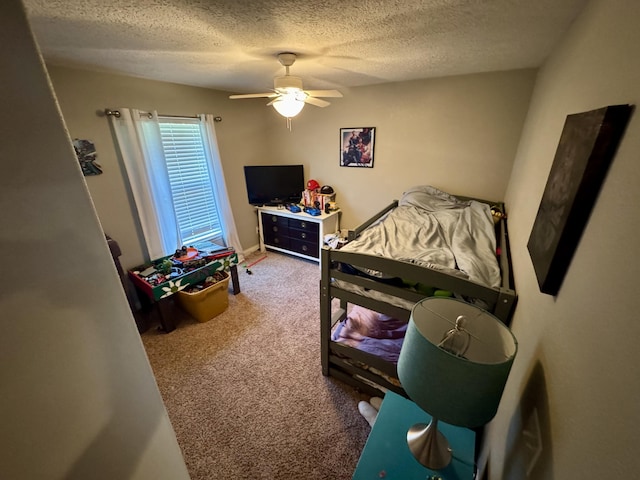 5537 S Pinehurst Ave, Springfield, MO 65810 - bedroom featuring a textured ceiling, carpet floors, and a ceiling fan