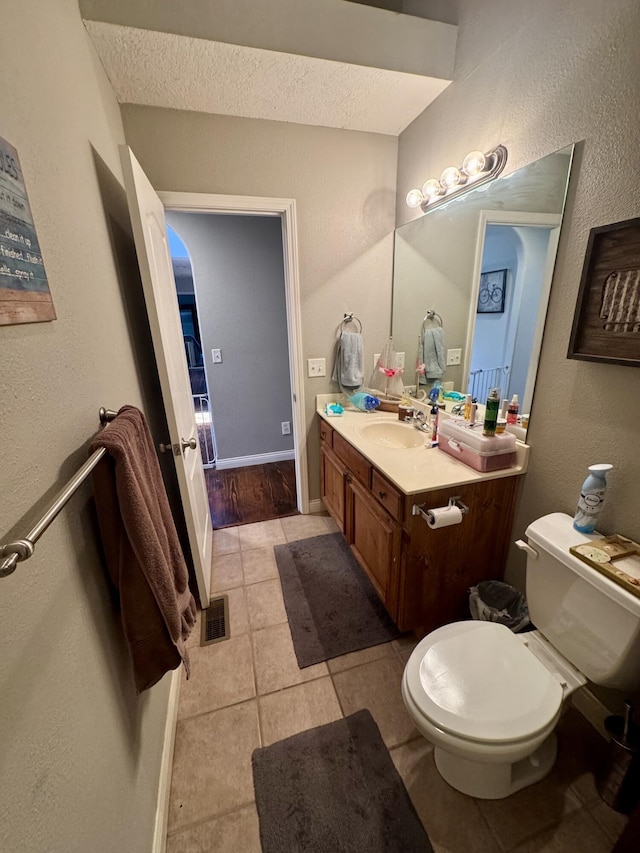 5537 S Pinehurst Ave, Springfield, MO 65810 - bathroom with vanity, tile patterned floors, a textured wall, and a textured ceiling