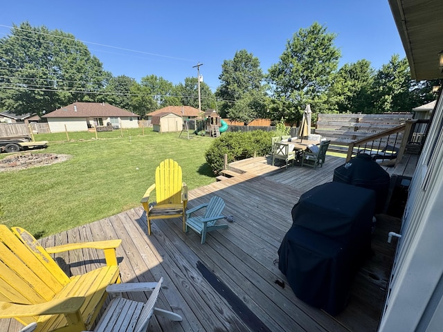 5537 S Pinehurst Ave, Springfield, MO 65810 - deck with a playground, a yard, and a storage unit