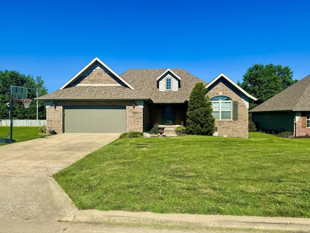 5537 S Pinehurst Ave, Springfield, MO 65810 - view of front of home with brick siding, an attached garage, driveway, a front lawn, and a shingled roof