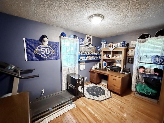 16610 S 1375th Rd, Nevada, MO 64772 - home office with wood finished floors and a textured ceiling