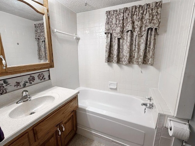 16610 S 1375th Rd, Nevada, MO 64772 - bathroom featuring a textured ceiling, vanity, and shower / bath combination