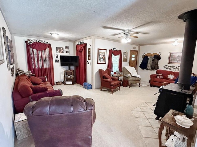 16610 S 1375th Rd, Nevada, MO 64772 - living area featuring a wood stove, ceiling fan, carpet flooring, and a textured ceiling