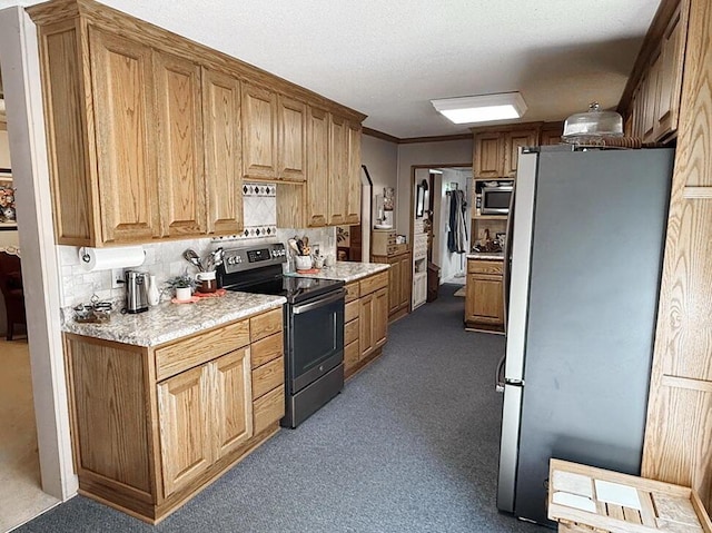 16610 S 1375th Rd, Nevada, MO 64772 - kitchen with stainless steel appliances, light countertops, dark colored carpet, and tasteful backsplash