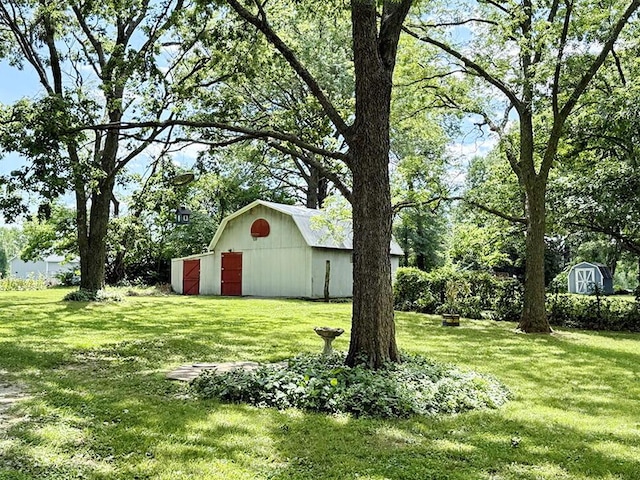 16610 S 1375th Rd, Nevada, MO 64772 - view of grassy yard featuring a detached garage, a storage unit, and a pole building