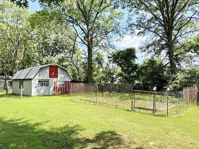 16610 S 1375th Rd, Nevada, MO 64772 - view of yard featuring an outbuilding, a barn, and view of wooded area
