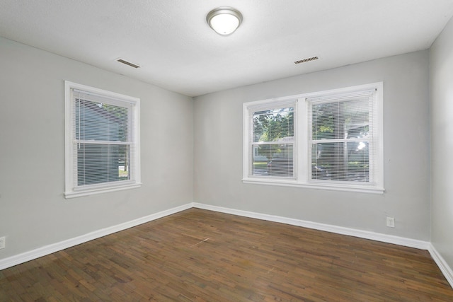 1739 S S Ave, Springfield, MO 65807 - empty room with dark wood-style flooring