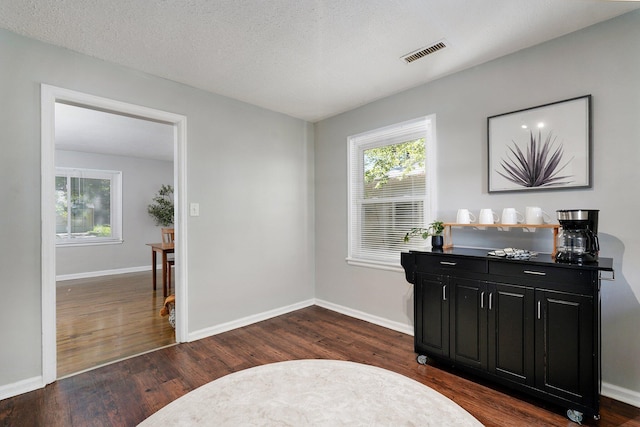 1739 S S Ave, Springfield, MO 65807 - living area featuring dark wood-style flooring and healthy amount of natural light