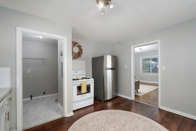 1739 S S Ave, Springfield, MO 65807 - kitchen with freestanding refrigerator, white electric range, dark wood-style floors, and light countertops