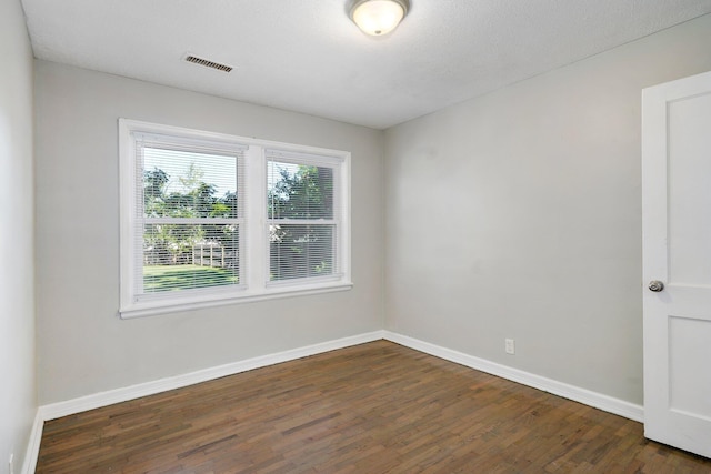 1739 S S Ave, Springfield, MO 65807 - unfurnished room featuring dark wood finished floors and baseboards