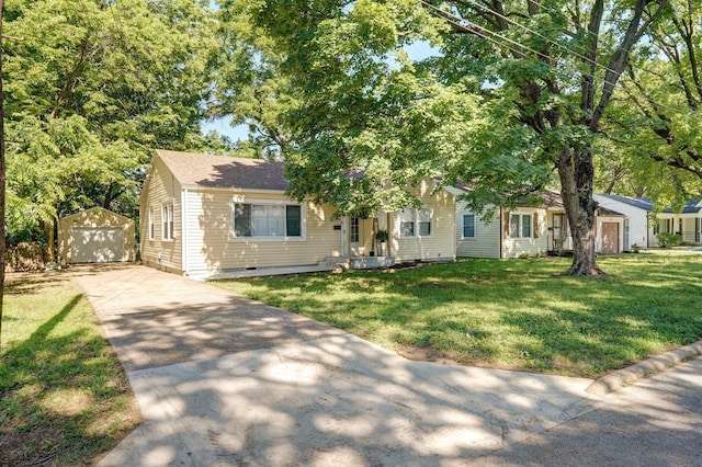 1739 S S Ave, Springfield, MO 65807 - view of front of property with concrete driveway, an outbuilding, a garage, and a front yard