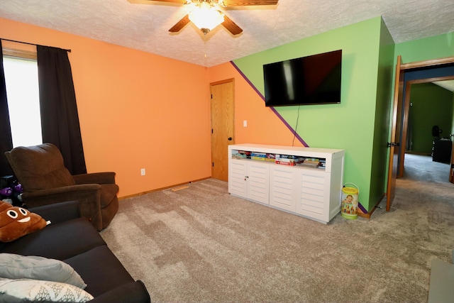 576 S Barnstable, Nixa, MO 65714 - living area with carpet floors, a textured ceiling, and a ceiling fan