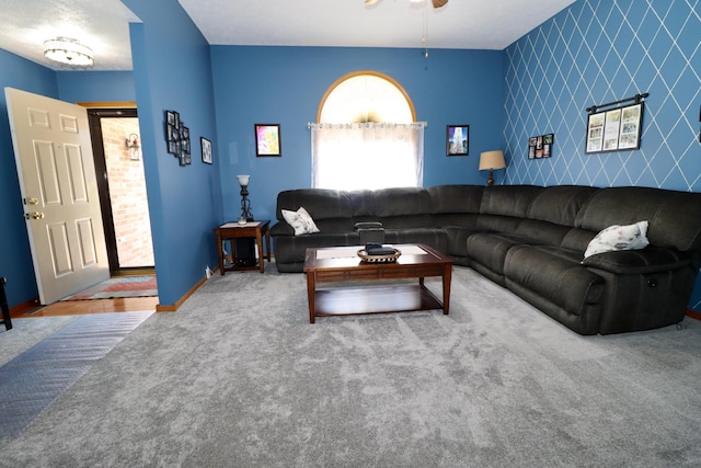 576 S Barnstable, Nixa, MO 65714 - carpeted living area featuring an accent wall, healthy amount of natural light, and a ceiling fan