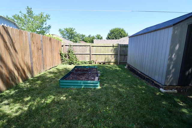 576 S Barnstable, Nixa, MO 65714 - fenced backyard featuring a garden and an outdoor structure