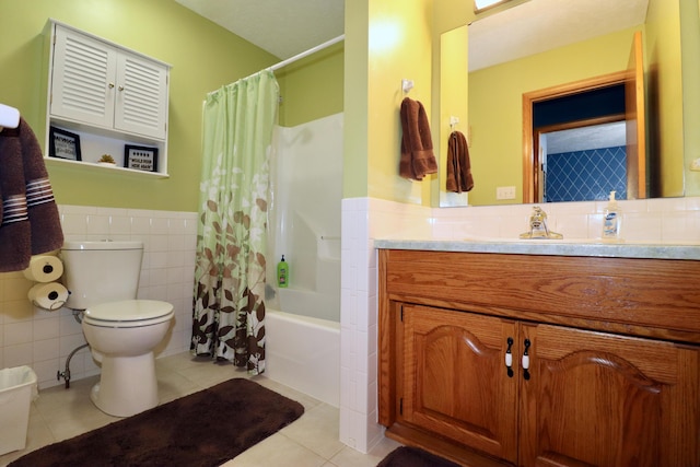 576 S Barnstable, Nixa, MO 65714 - bathroom featuring tile walls, tile patterned flooring, vanity, wainscoting, and shower / tub combo