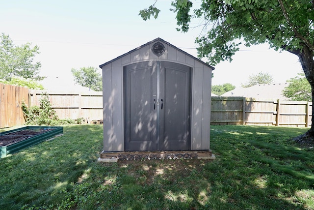 576 S Barnstable, Nixa, MO 65714 - view of shed with a fenced backyard and a vegetable garden