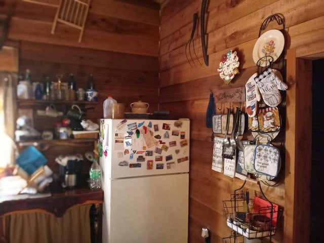 2240 Racetrack Hollow Rd, Anderson, MO 64831 - kitchen with freestanding refrigerator and wood walls