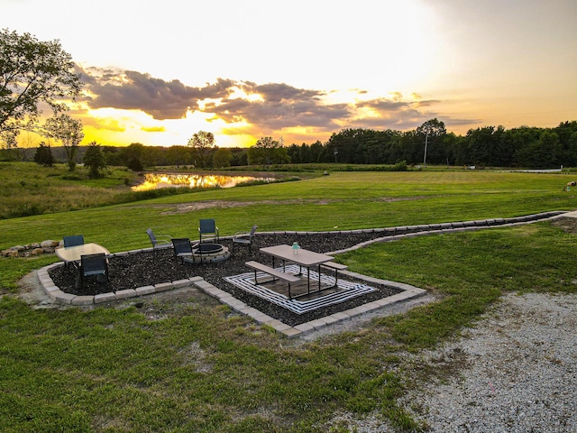 30950 E 54th Hwy, El Dorado Springs, MO 64744 - surrounding community featuring a fire pit, a water view, and a yard