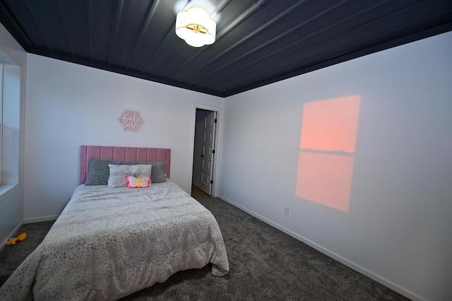 30950 E 54th Hwy, El Dorado Springs, MO 64744 - bedroom with dark colored carpet and baseboards