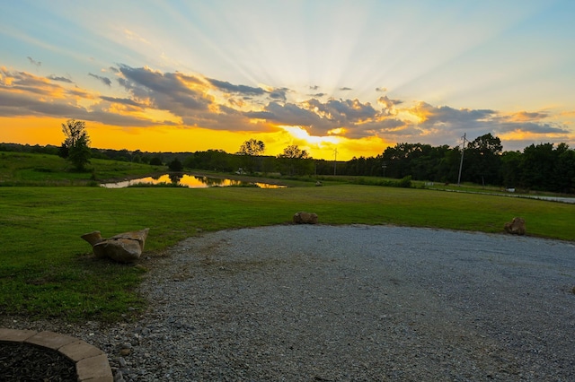 30950 E 54th Hwy, El Dorado Springs, MO 64744 - view of home's community with a water view and a lawn