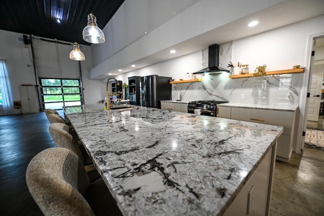 30950 E 54th Hwy, El Dorado Springs, MO 64744 - kitchen with wall chimney range hood, range with gas cooktop, open shelves, black refrigerator with ice dispenser, and a high ceiling