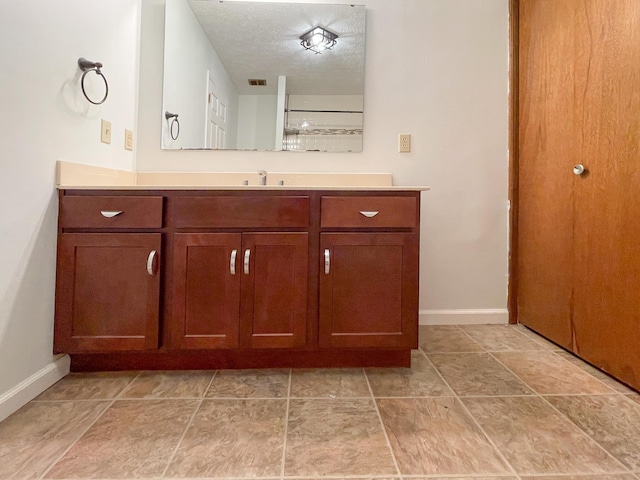 2924 S Roanoke Ave, Springfield, MO 65807 - bathroom featuring vanity and a textured ceiling