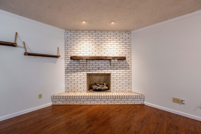 2924 S Roanoke Ave, Springfield, MO 65807 - unfurnished living room with a brick fireplace, a textured ceiling, wood finished floors, and crown molding