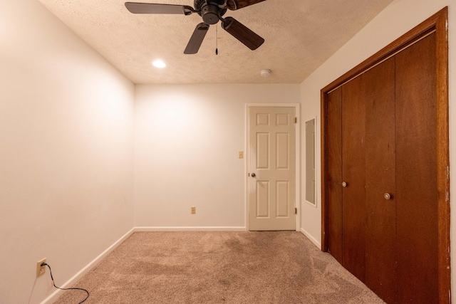 2924 S Roanoke Ave, Springfield, MO 65807 - unfurnished bedroom with a textured ceiling, light colored carpet, a closet, ceiling fan, and recessed lighting
