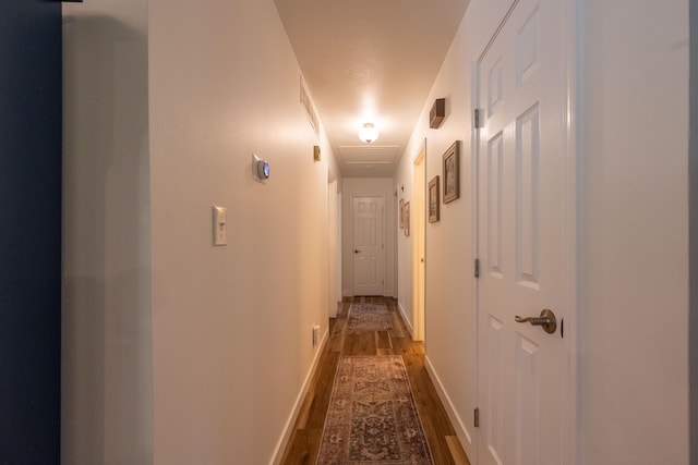 1728 E Camino Alto St, Springfield, MO 65804 - hallway with dark wood-type flooring and baseboards