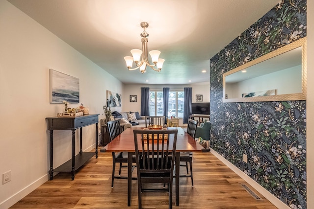 1728 E Camino Alto St, Springfield, MO 65804 - dining area with a chandelier, wood finished floors, wallpapered walls, and recessed lighting