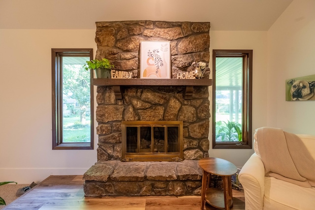 1728 E Camino Alto St, Springfield, MO 65804 - living area featuring wood finished floors and a fireplace