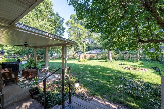 1728 E Camino Alto St, Springfield, MO 65804 - fenced backyard with ceiling fan