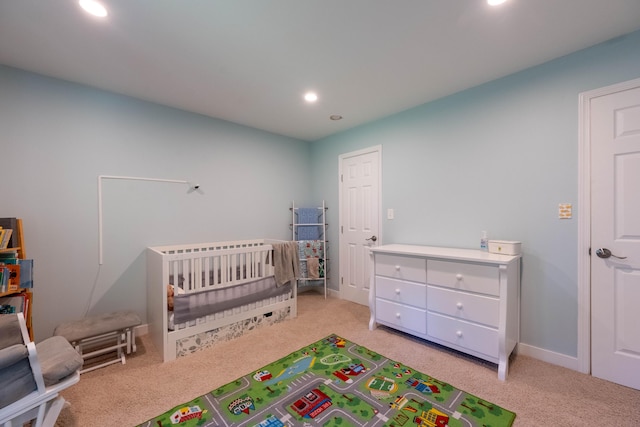 1728 E Camino Alto St, Springfield, MO 65804 - bedroom featuring light carpet, recessed lighting, and a crib