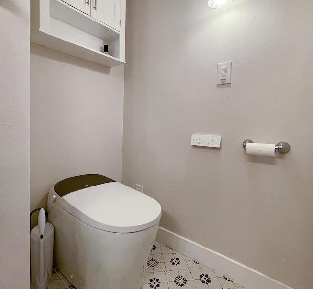 1728 E Camino Alto St, Springfield, MO 65804 - bathroom featuring toilet and tile patterned flooring
