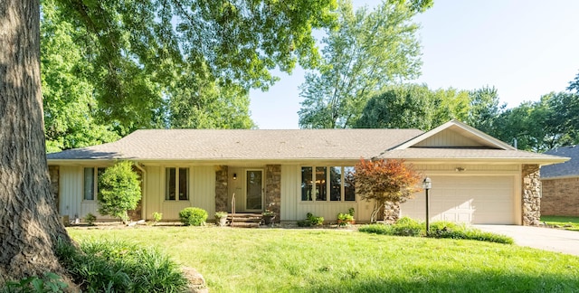 1728 E Camino Alto St, Springfield, MO 65804 - ranch-style house with stone siding, driveway, a garage, a front yard, and roof with shingles