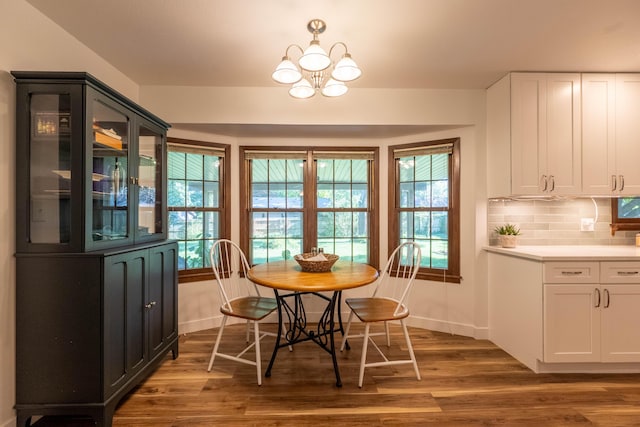 1728 E Camino Alto St, Springfield, MO 65804 - dining space featuring a chandelier and wood finished floors