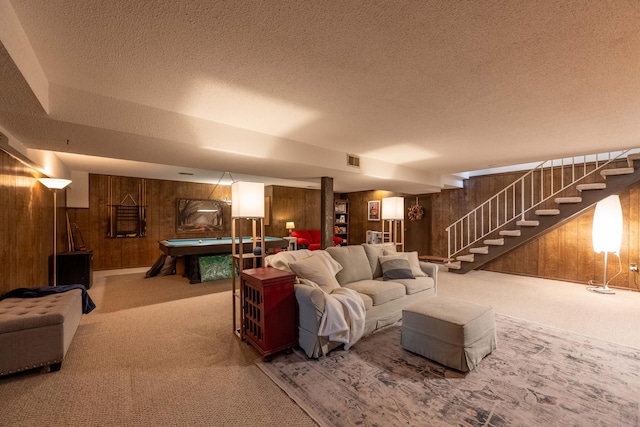 1728 E Camino Alto St, Springfield, MO 65804 - living area with wooden walls, carpet floors, billiards table, stairs, and a textured ceiling