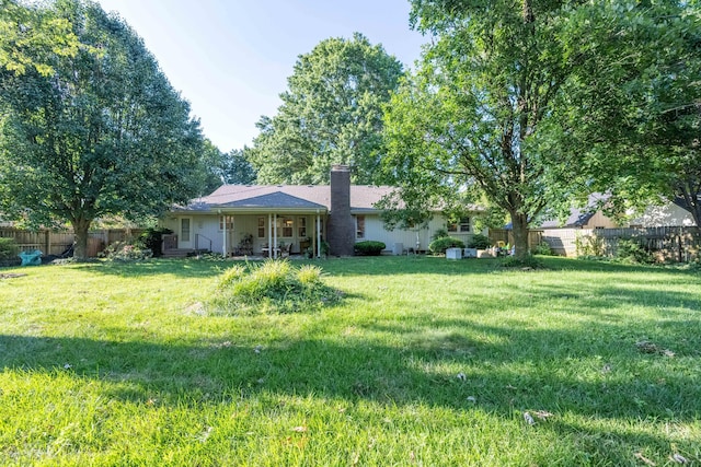 1728 E Camino Alto St, Springfield, MO 65804 - back of property with a chimney
