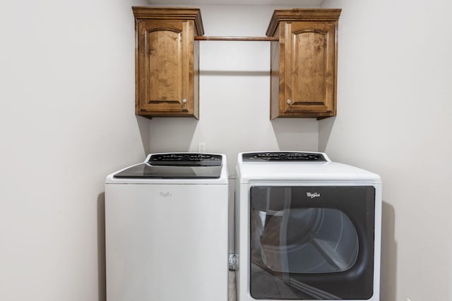 1545 N Oakfair Pl, Springfield, MO 65802 - laundry room featuring separate washer and dryer and cabinet space