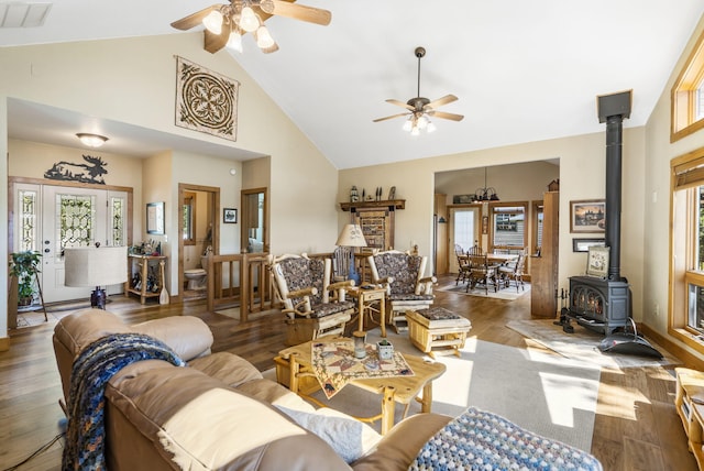 692 Indian Valley Rd, Branson West, MO 65737 - living area featuring a wood stove, ceiling fan, high vaulted ceiling, and wood finished floors