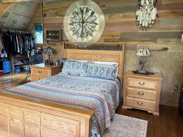 421 N Emory Creek Rd, Walnut Shade, MO 65771 - bedroom with hardwood / wood-style flooring, wood walls, and a closet