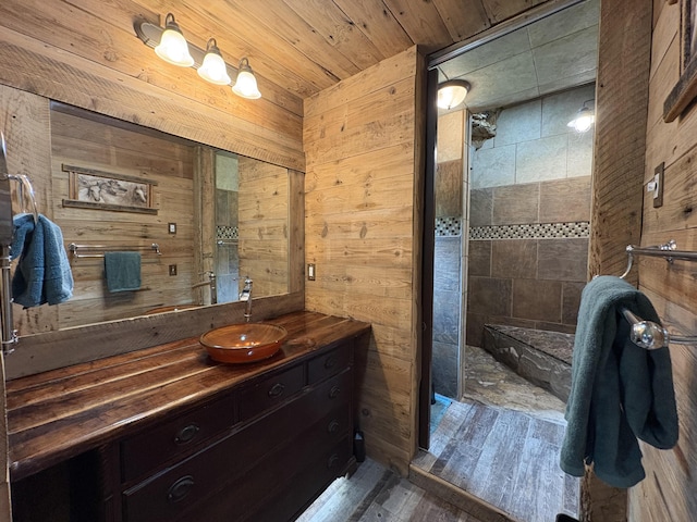 421 N Emory Creek Rd, Walnut Shade, MO 65771 - full bath featuring wood walls, vanity, wood finished floors, and a tile shower