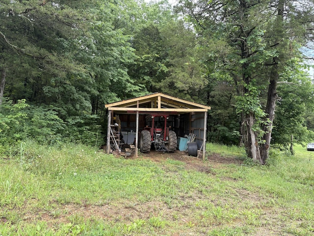 421 N Emory Creek Rd, Walnut Shade, MO 65771 - view of pole building featuring a view of trees and a detached carport