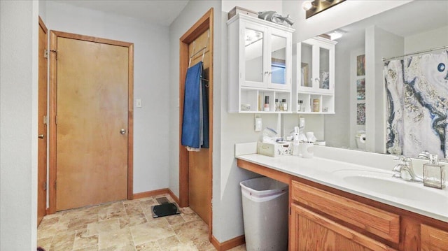 2005 Debra Dr, West Plains, MO 65775 - full bath featuring stone finish flooring, vanity, and curtained shower