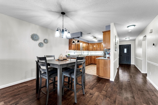 150 Sunken Forest Dr Unit 10-253, Forsyth, MO 65653 - dining area with wood finished floors, a chandelier, and a textured ceiling