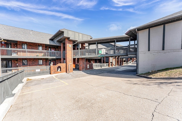 150 Sunken Forest Dr Unit 10-253, Forsyth, MO 65653 - view of building exterior with uncovered parking