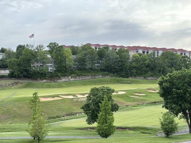 330 S Wildwood Dr Unit B1, Branson, MO 65616 - view of community with a lawn and view of golf course
