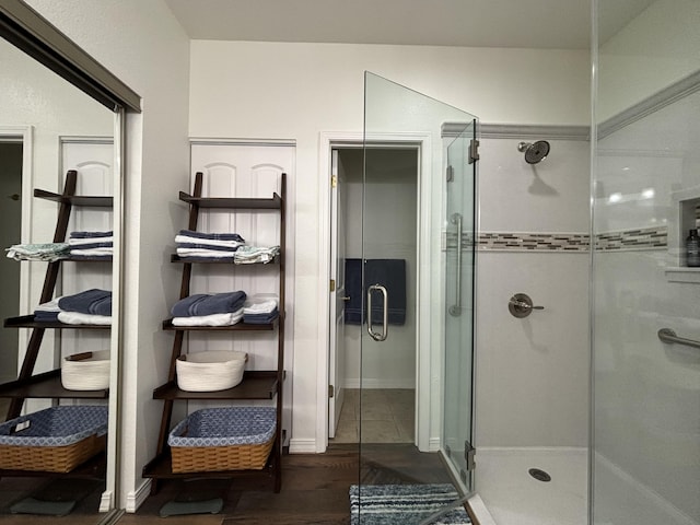 330 S Wildwood Dr Unit B1, Branson, MO 65616 - bathroom featuring a stall shower and wood finished floors