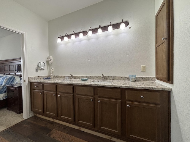330 S Wildwood Dr Unit B1, Branson, MO 65616 - ensuite bathroom featuring wood finished floors and double vanity