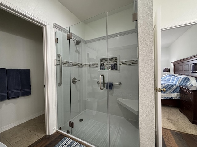 330 S Wildwood Dr Unit B1, Branson, MO 65616 - ensuite bathroom featuring a stall shower and wood finished floors